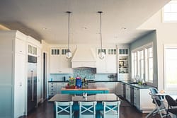 Modern white kitchen with blue accents